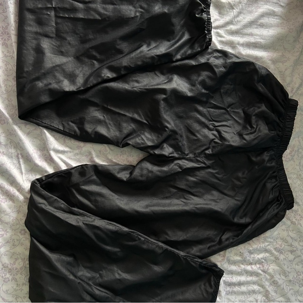 Women's black parachute pants